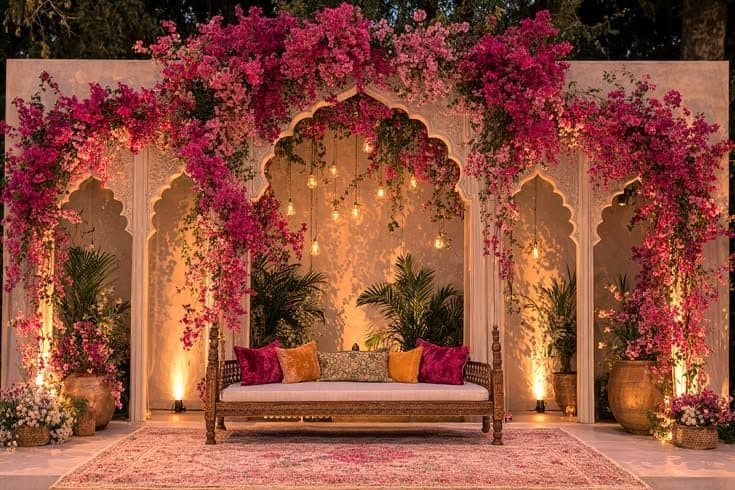 Pink bougainvillea arches over a vintage lounge seat